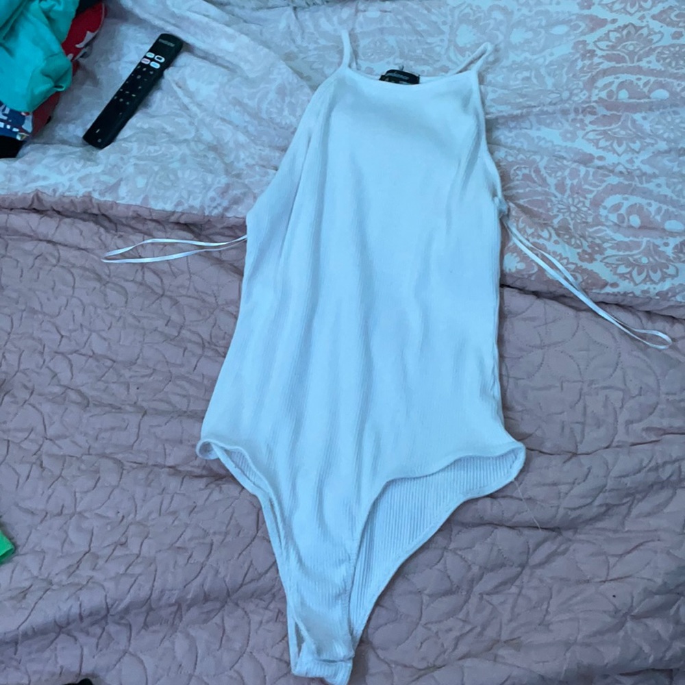 a white halter body suit